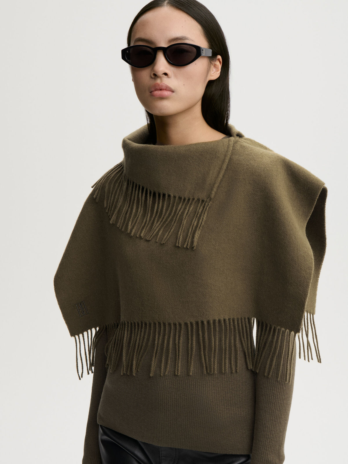 Turtla Wool Fringe Bib styled